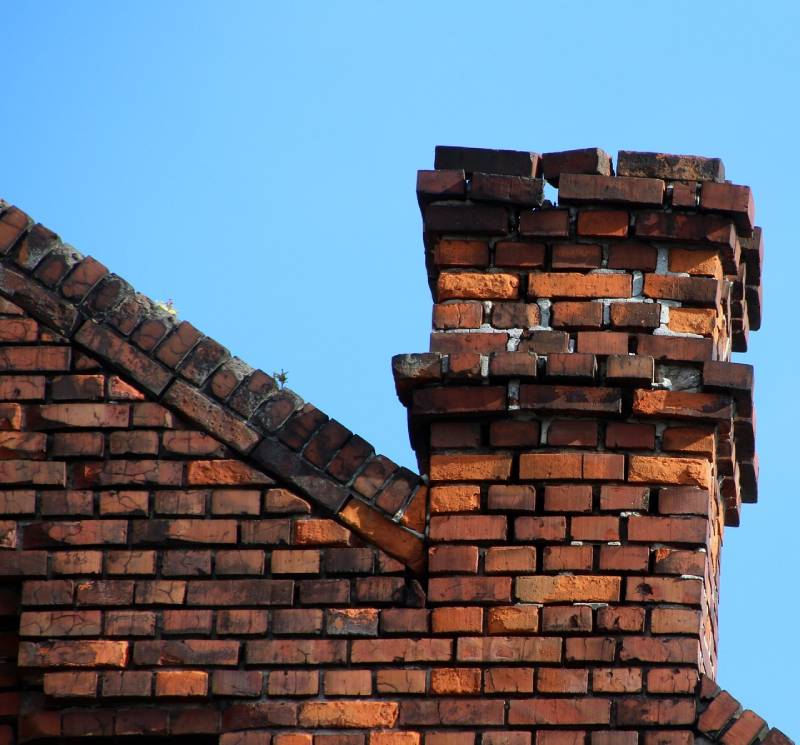 Damaged chimney on an Melvindale home showing cracks and missing mortar